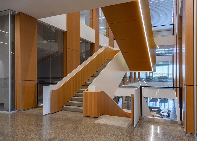 University of Lethbridge Science Commons Acoustic Wood: Custom fabricated perforated wood stair and column panels