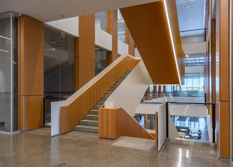 University of Lethbridge Science Commons Acoustic Wood: Custom fabricated perforated wood stair and column panels
